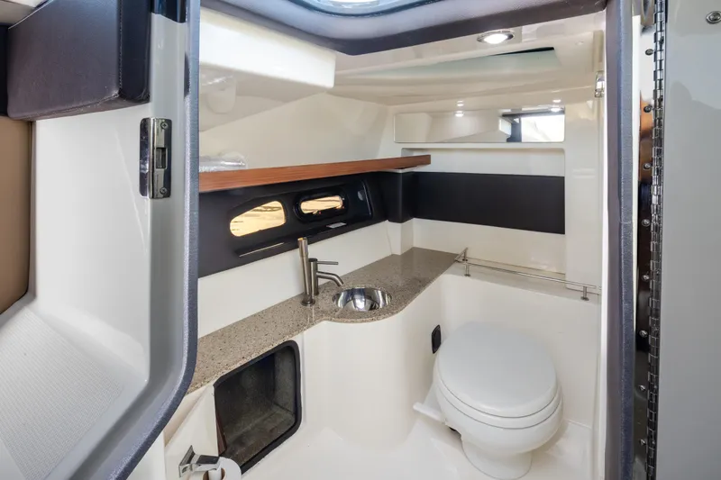 Slide: The Image of Luxurious 2016 Sea Ray SLX 350 boat bathroom with modern fixtures and sleek design. - 27