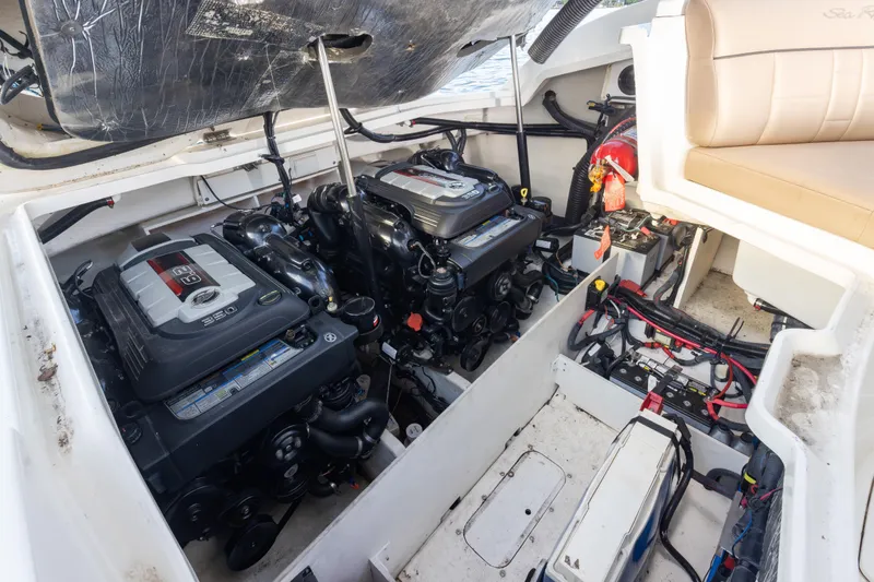 Slide: The Image of Engine compartment of a 2016 Sea Ray SLX 350 boat, showcasing dual engines. - 10