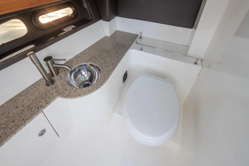 Slide: The Image of Luxurious bathroom interior of 2016 Sea Ray SLX 350 yacht with sink and toilet. - 28