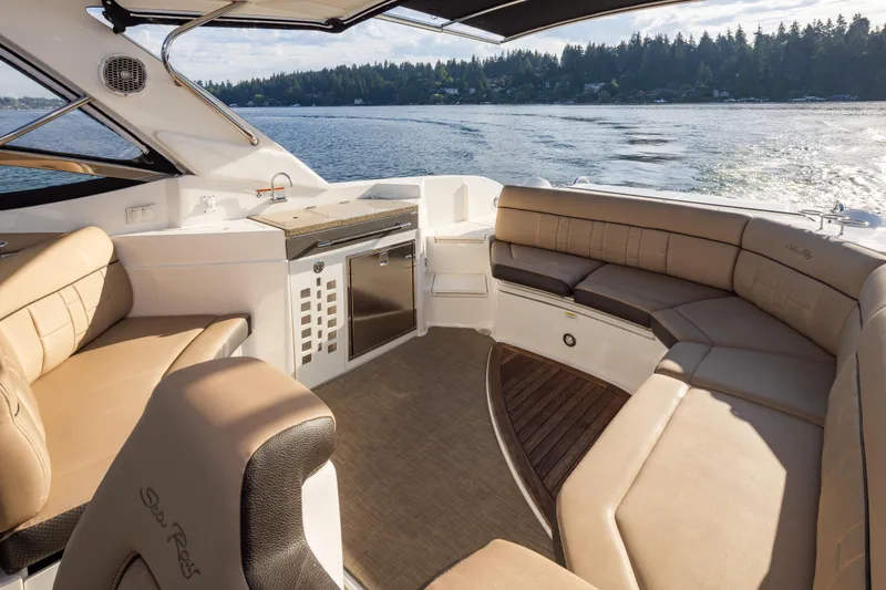 Slide: The Image of Luxurious interior of 2016 Sea Ray SLX 350 boat with spacious seating and scenic water view. - 18