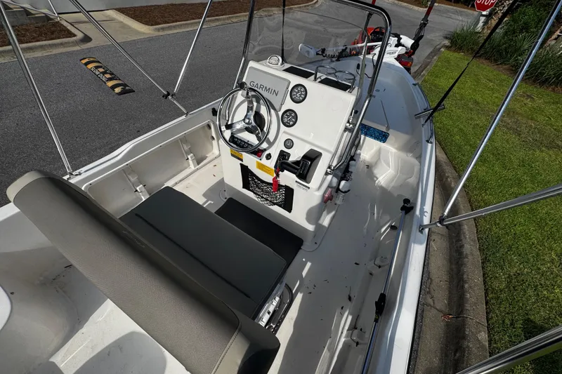 Slide: The Image of 2023 Key West 1720 Center Console boat interior with steering wheel and controls. - 5