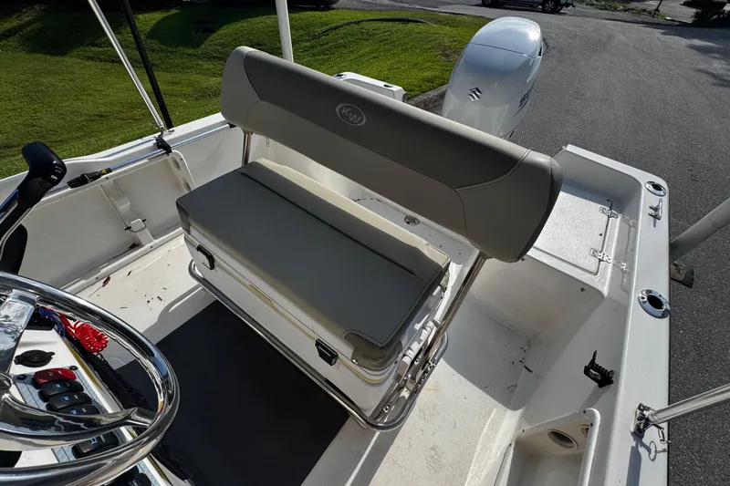 Slide: The Image of 2023 Key West 1720 Center Console boat interior with seating and controls. - 7