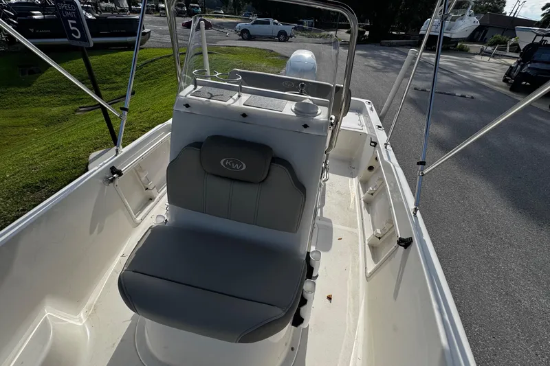 Slide: The Image of 2023 Key West 1720 Center Console boat interior with seating and console view. - 8