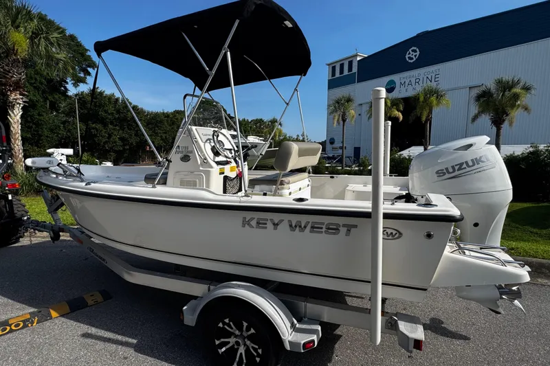 Slide: The Image of 2023 Key West 1720 Center Console boat with Suzuki engine on trailer. - 3