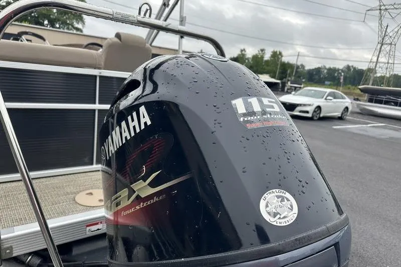 Slide: The Image of 2019 Bennington 20 SLM with Yamaha 115 horsepower outboard motor, wet with raindrops. - 4