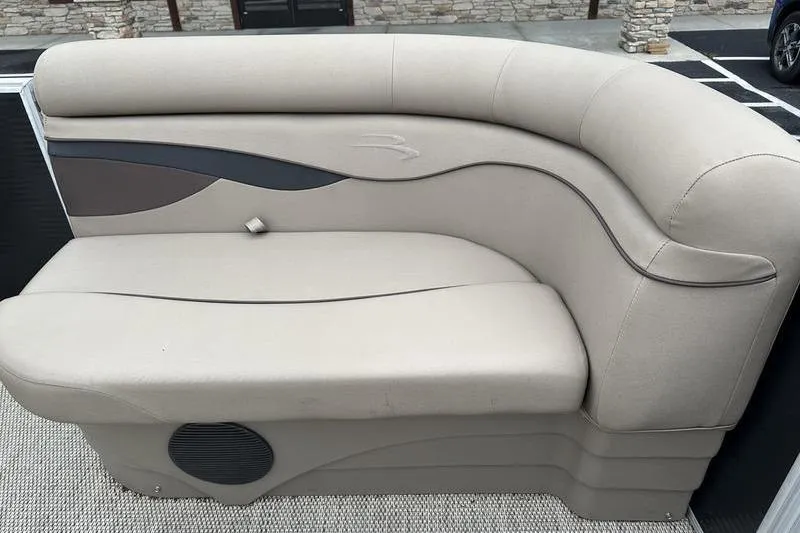 Slide: The Image of 2019 Bennington 20 SLM boat seating with beige upholstery and stylish design. - 9