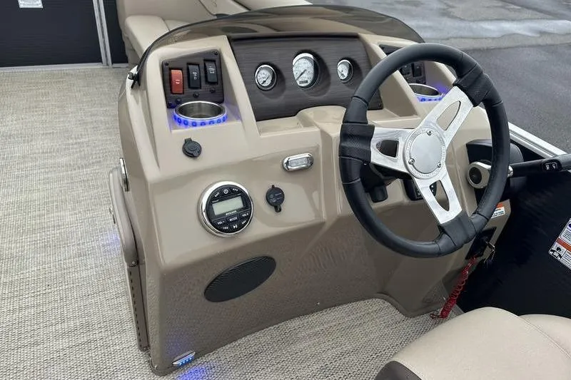 Slide: The Image of Steering console of a 2019 Bennington 20 SLM boat with gauges and controls. - 21