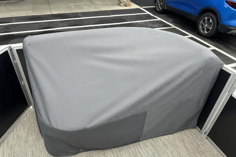Slide: The Image of Covered 2019 Bennington 20 SLM pontoon boat in parking lot. - 7