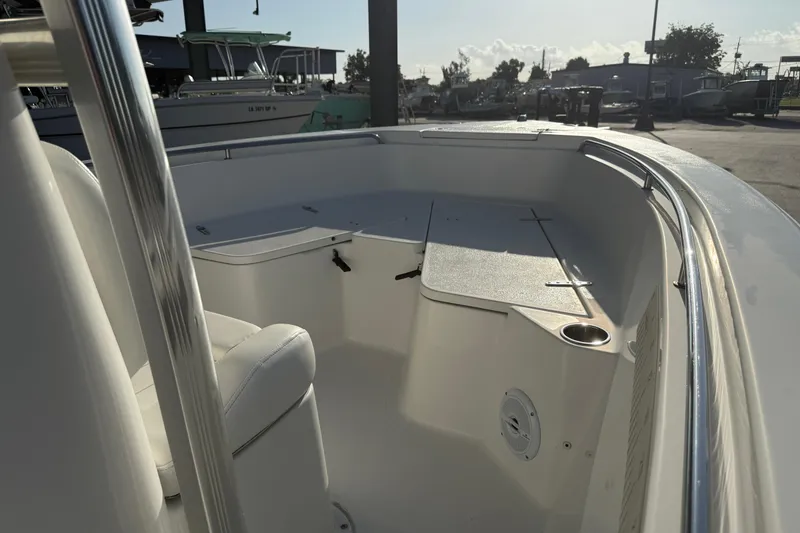 Slide: The Image of 2015 Sea Hunt Triton 225 boat interior with seating and storage compartments. - 11