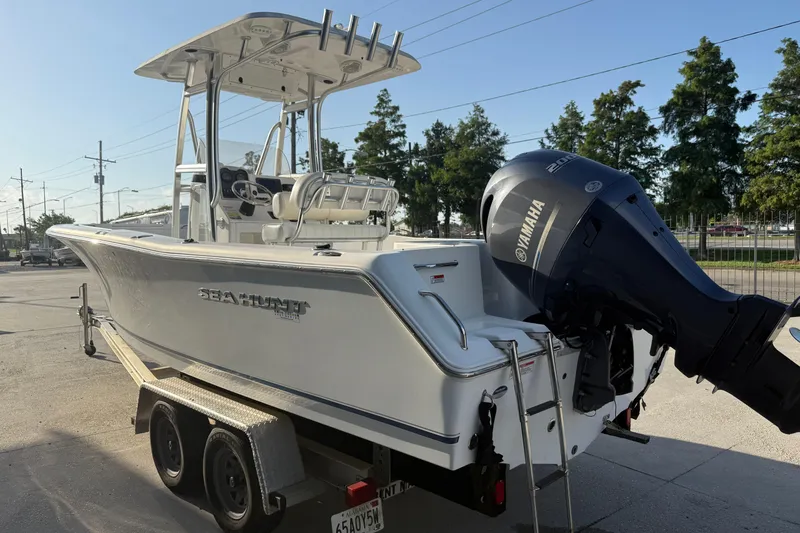Slide: The Image of 2015 Sea Hunt Triton 225 boat on trailer with Yamaha outboard motor. - 8