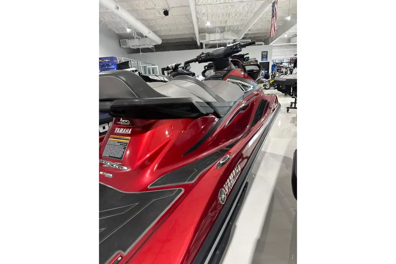 Slide: The Image of 2019 Yamaha WaveRunner VX Limited in showroom, featuring sleek red design and comfortable seating. - 15