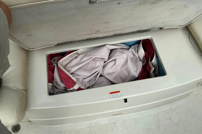 Slide: The Image of Storage compartment on a 2014 Tahoe Q7i boat with life jackets inside. - 8