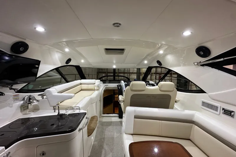 Slide: The Image of Luxurious interior of 2014 Sea Ray 410 Sundancer yacht with plush seating and modern amenities. - 12