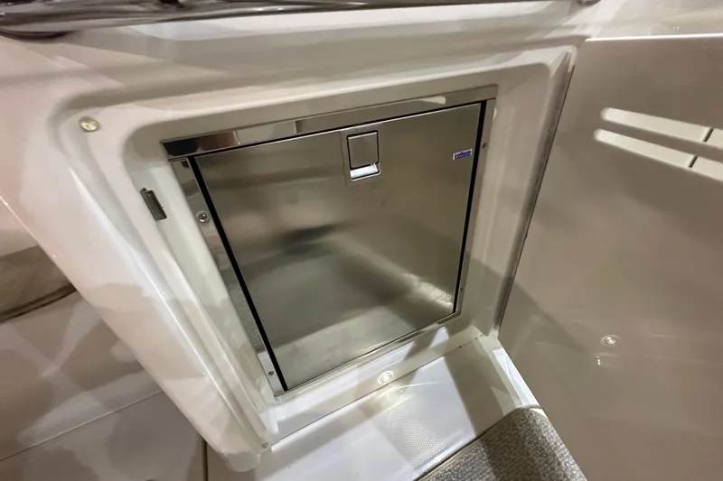 Slide: The Image of Stainless steel refrigerator on 2014 Sea Ray 410 Sundancer yacht interior. - 10
