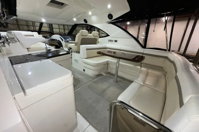 Slide: The Image of Luxurious interior of 2014 Sea Ray 410 Sundancer yacht with plush seating and modern amenities. - 6