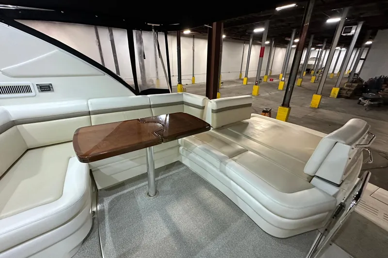 Slide: The Image of Luxurious interior of 2014 Sea Ray 410 Sundancer yacht with elegant seating and wooden table. - 5