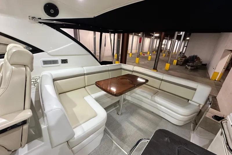 Slide: The Image of Luxurious seating area on a 2014 Sea Ray 410 Sundancer yacht with elegant table. - 7