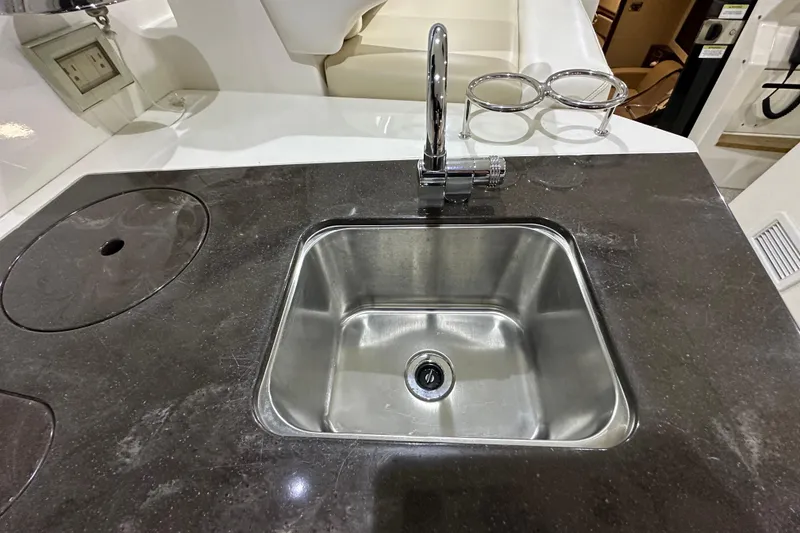 Slide: The Image of Stainless steel sink on 2014 Sea Ray 410 Sundancer yacht with sleek countertop design. - 11