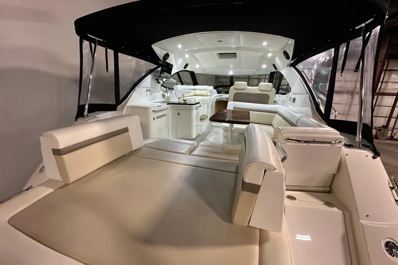Slide: The Image of Luxurious interior of 2014 Sea Ray 410 Sundancer yacht with elegant seating and modern amenities. - 4
