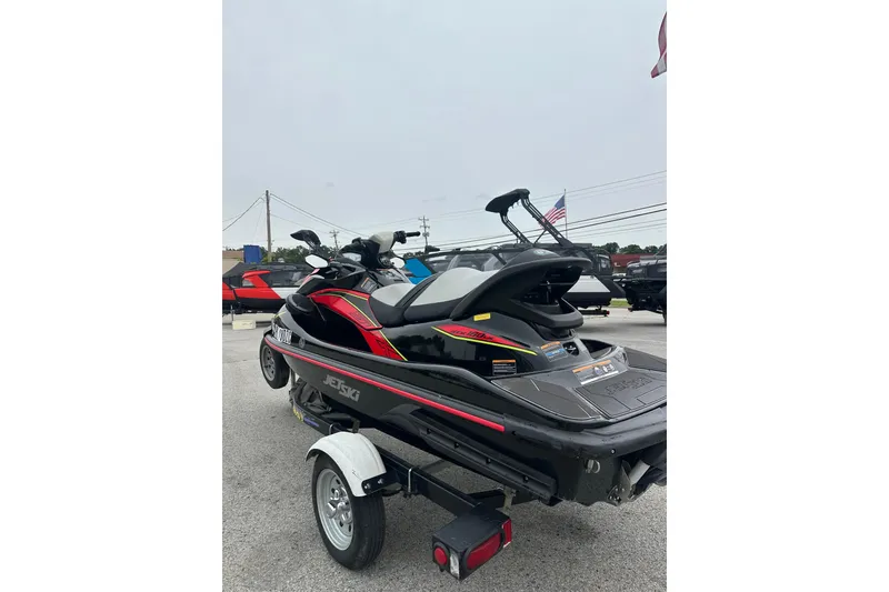 The Image of 2024 Kawasaki Jetski STX 160LX on trailer, displayed outdoors. - 1