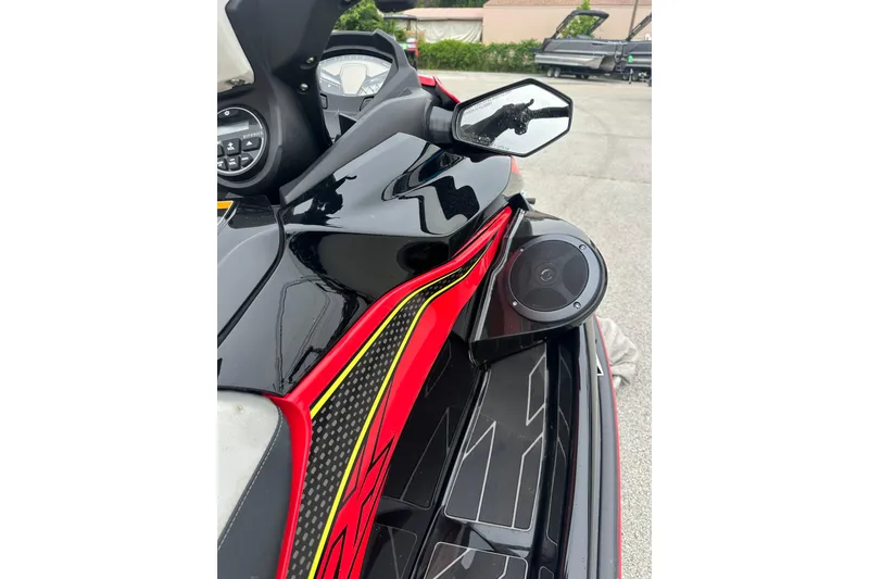 Slide: The Image of 2024 Kawasaki Jetski STX 160LX with sleek design and vibrant red accents. - 7