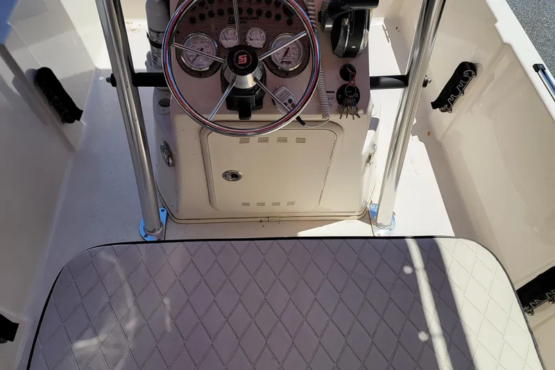 Slide: The Image of 2021 Carolina Skiff 178 JLS boat console with steering wheel and gauges. - 13