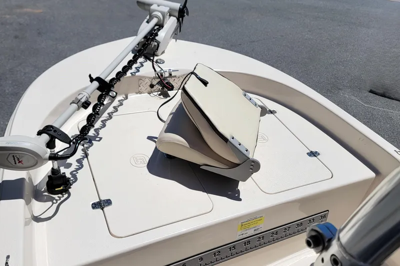 Slide: The Image of 2021 Carolina Skiff 178 JLS boat deck with trolling motor and folded seat. - 8