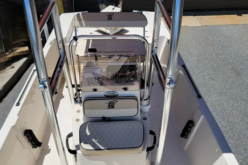 Slide: The Image of 2021 Carolina Skiff 178 JLS boat interior with seating and console, featuring sleek design elements. - 9