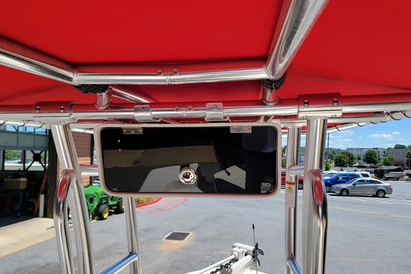 Slide: The Image of 2021 Carolina Skiff 178 JLS boat with red canopy and stainless steel frame. - 14