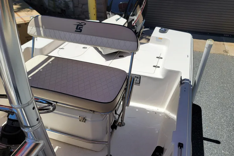 Slide: The Image of 2021 Carolina Skiff 178 JLS boat interior with cushioned seating and storage. - 10