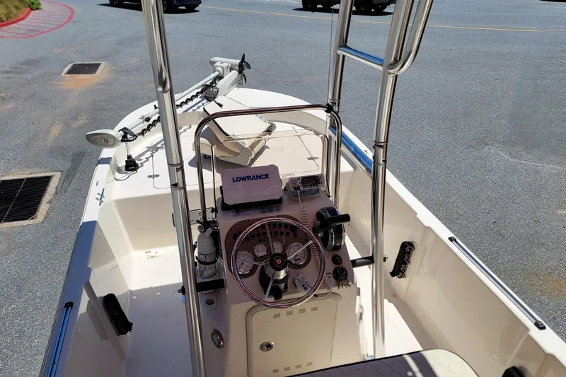 Slide: The Image of 2021 Carolina Skiff 178 JLS boat interior with steering console and Lowrance equipment. - 12