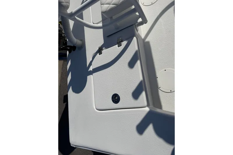 Slide: The Image of 2026 Skuta 24 Cat boat deck with storage compartment and seating. - 58