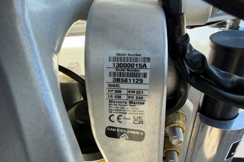Slide: The Image of Label on Skuta 24 Cat 2026 engine, showing model and serial numbers, Mercury Marine details. - 26