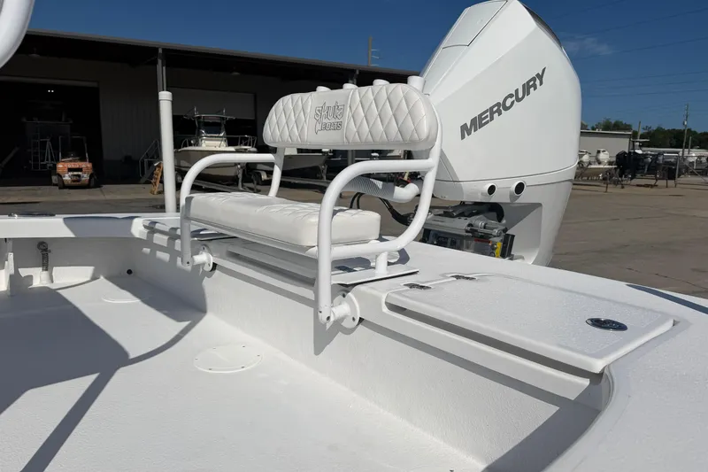 Slide: The Image of Skuta 24 Cat 2026 boat with Mercury engine, featuring white seating and deck. - 9