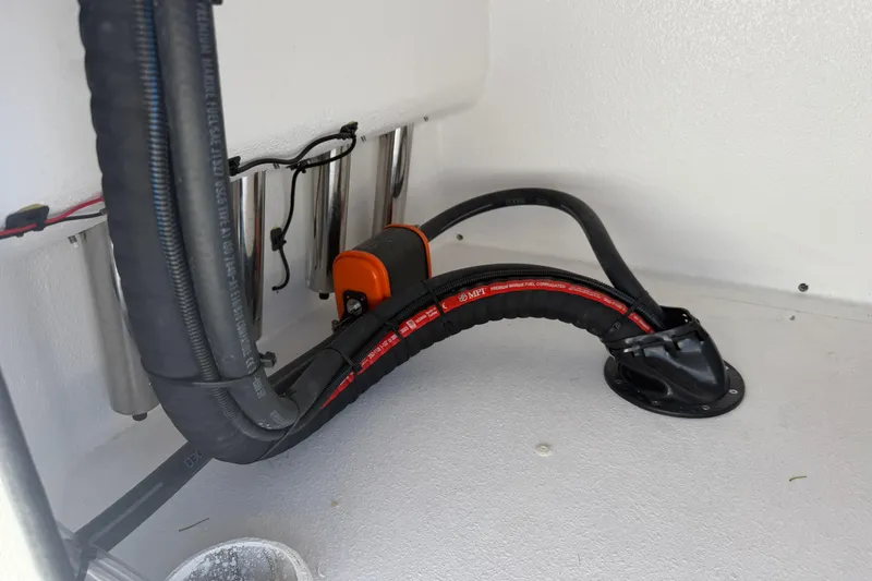 Slide: The Image of Interior view of Skuta 24 Cat 2026, showcasing wiring and hose setup. - 53
