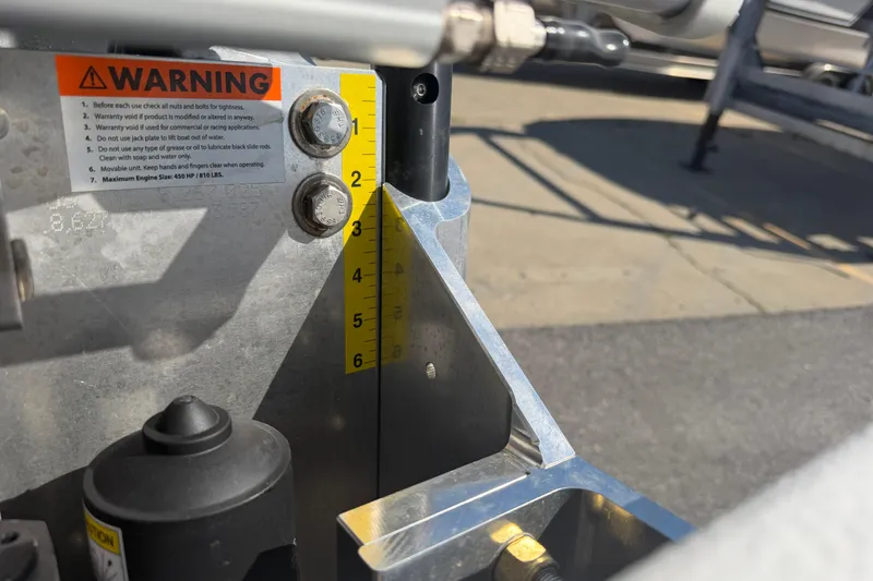Slide: The Image of Close-up of Skuta 24 Cat 2026 machinery with warning label and measurement markings. - 25