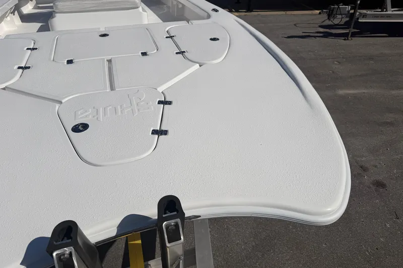 Slide: The Image of 2026 Skuta 24 Cat boat deck, featuring sleek design and storage compartments. - 14