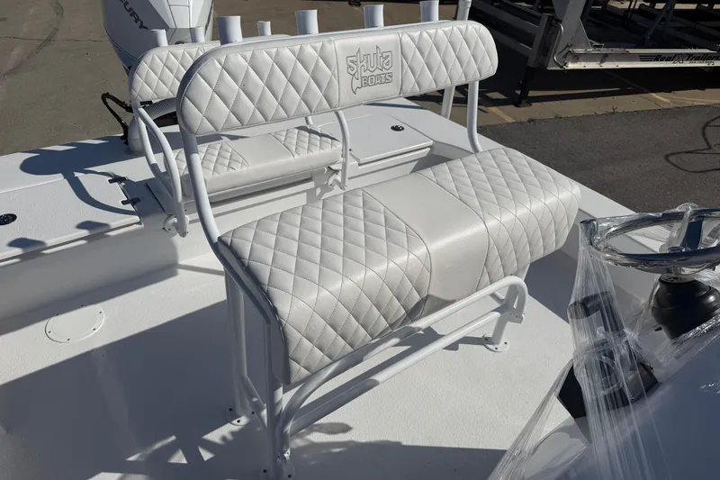 Slide: The Image of White quilted seating on a 2026 Skuta 24 Cat boat, featuring sleek design and comfort. - 47