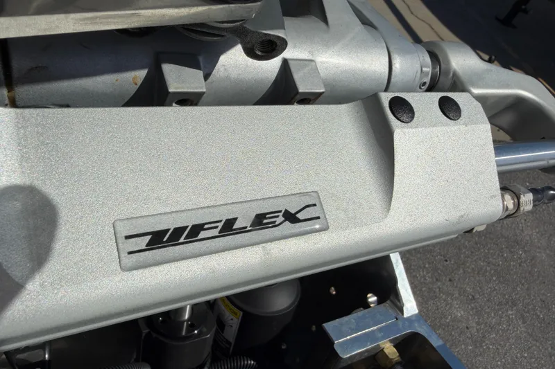 Slide: The Image of Close-up of Skuta 24 Cat 2026 engine component with Uflex branding. - 24