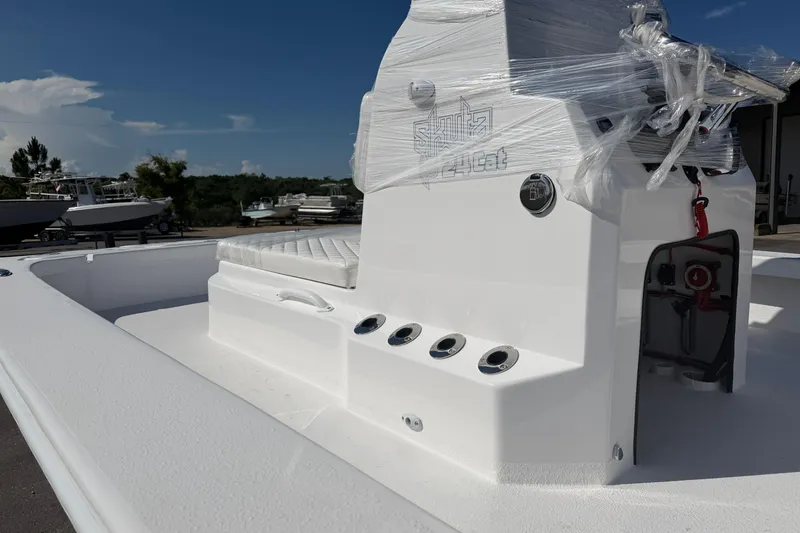 Slide: The Image of 2026 Skuta 24 Cat boat with sleek white design and modern features. - 8