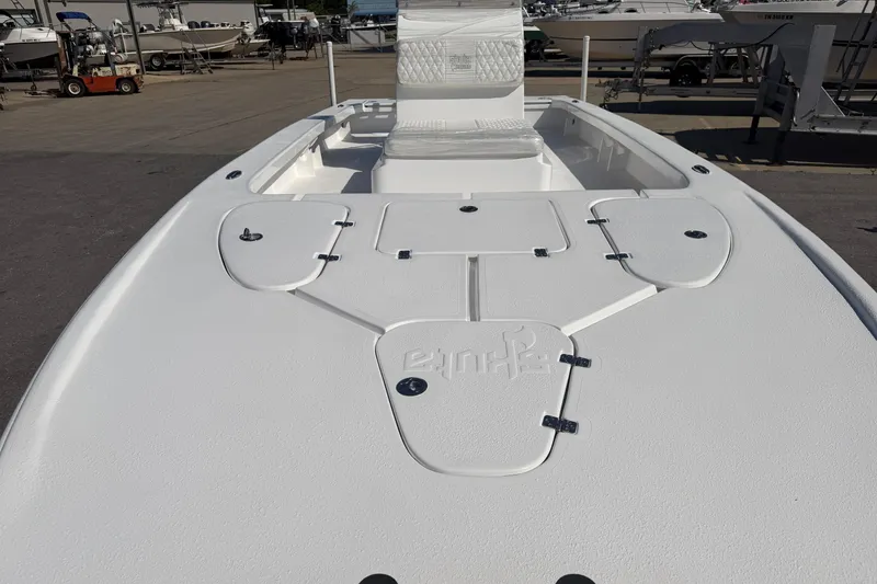 Slide: The Image of White Skuta 24 Cat boat deck, 2026 model, with storage compartments and seating. - 12