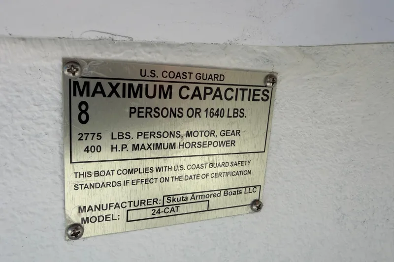 Slide: The Image of Plaque detailing maximum capacities for Skuta 24 Cat boat, 2026 model. - 35