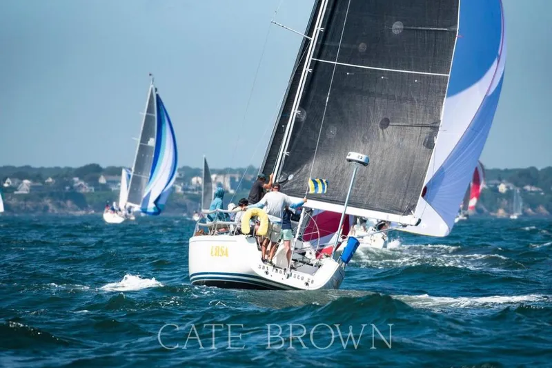 Slide: The Image of Sailboats racing on the ocean, featuring a 2004 J Boats J/109. - 10