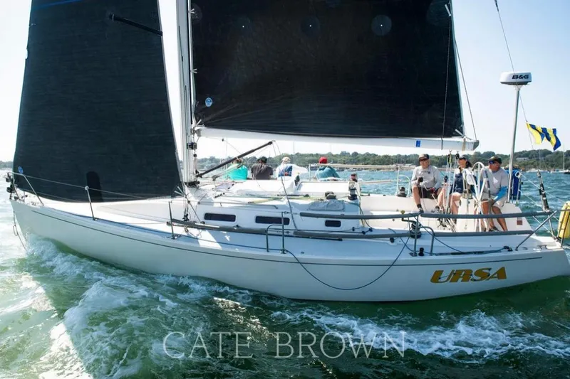 Slide: The Image of 2004 J Boats J/109 sailboat "URSA" sailing with crew on a sunny day. - 7