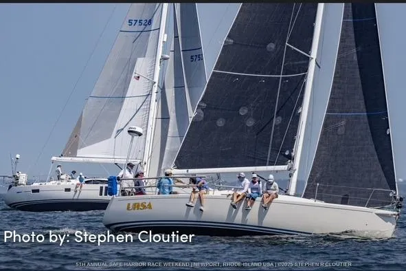 Slide: The Image of Sailboats racing in Newport, featuring a 2004 J Boats J/109 model. - 5