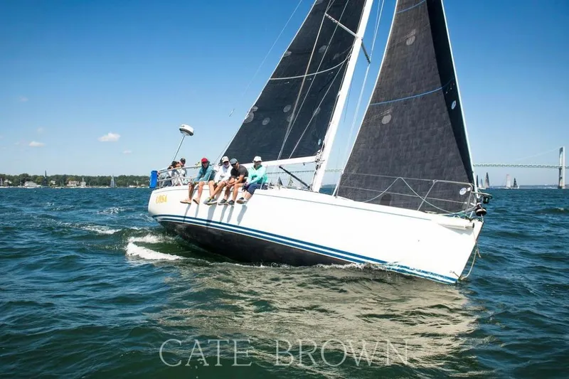 Slide: The Image of Sailing J Boats J/109, 2004 model, with crew on deck in open water. - 4