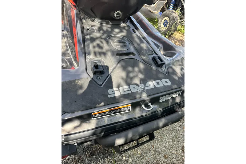 Slide: The Image of 2022 Sea-Doo GTI SE 130 rear deck with logo and shadowed surface. - 13