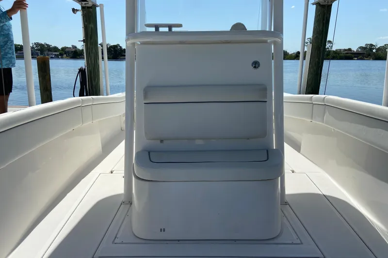 Slide: The Image of 2017 Stamas 317 Tarpon boat interior with seating, docked by calm waters. - 56