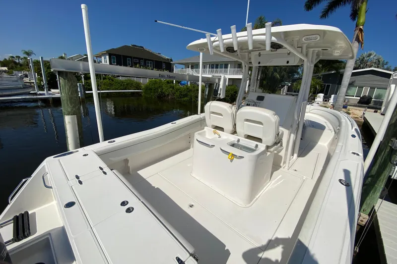 Slide: The Image of 2017 Stamas 317 Tarpon boat docked, featuring spacious deck and dual seating. - 12