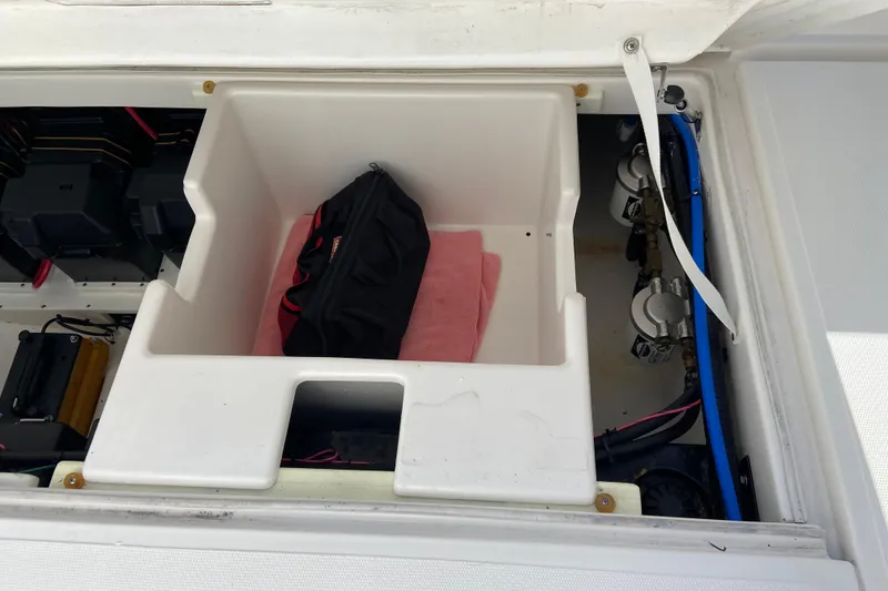 Slide: The Image of Storage compartment of a 2017 Stamas 317 Tarpon boat with equipment and wiring. - 20